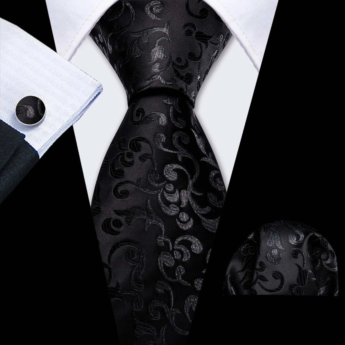 Black paisley silk necktie paired with white dress shirt.
